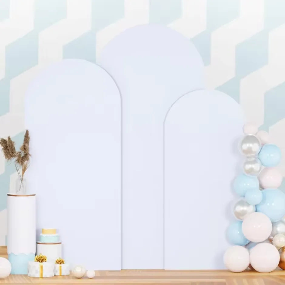 A set of three white spandex wedding arch covers displayed against a light blue and white geometric background.