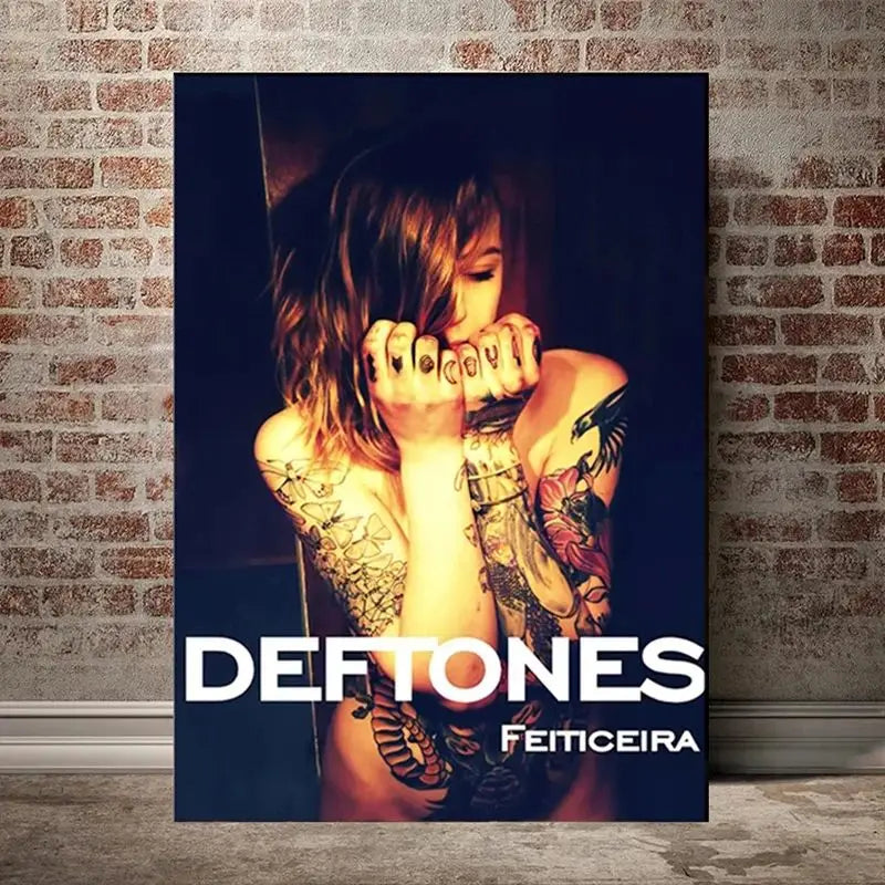 A dark, moody photograph of a person with intricate tattoos looking towards the camera.