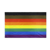 A horizontal Pride rainbow flag banner featuring six colored stripes: black, dark brown, orange, red, yellow, green, and blue