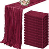 A set of ten terracotta semi-sheer cheesecloth table runners in a deep maroon color.
