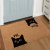 A brown non-slip doormat featuring black silhouettes of a cat saying Bye and Hi.