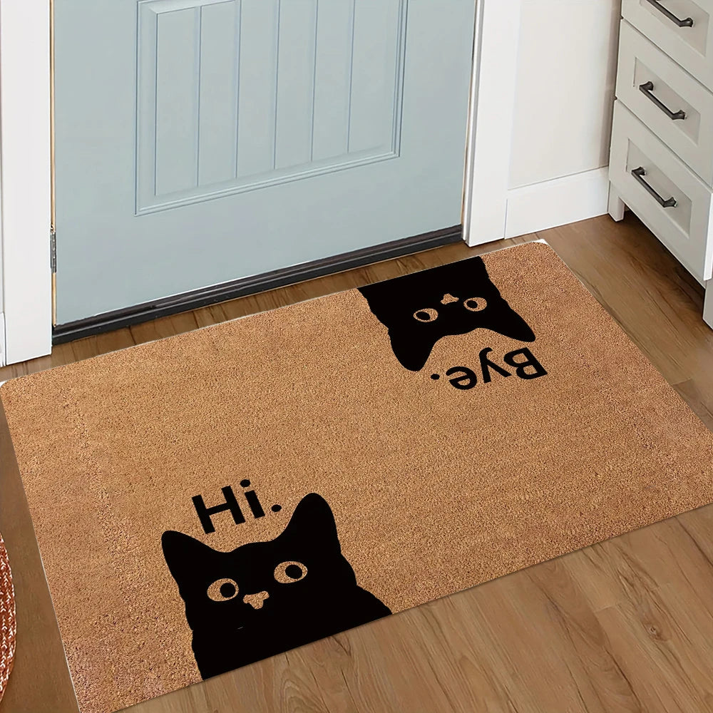A brown non-slip doormat featuring black silhouettes of a cat saying Bye and Hi.