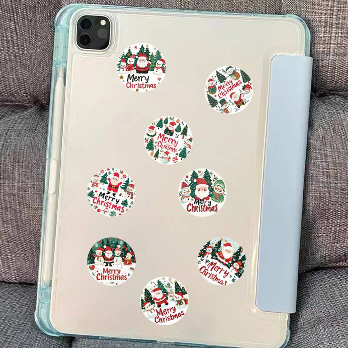 A clear phone case featuring multiple festive Christmas wreath stickers for decoration.