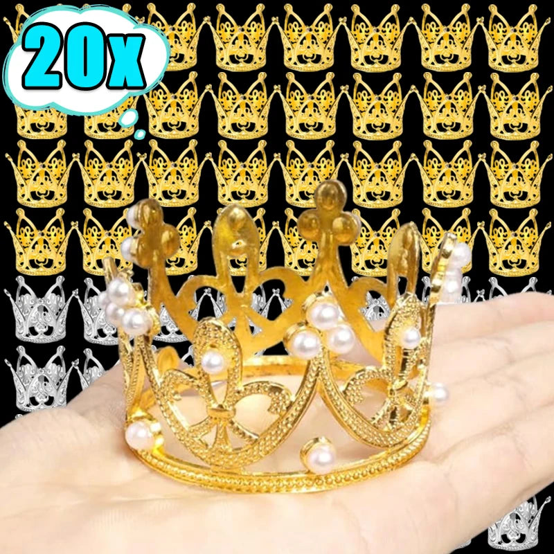 A golden crown made of gold-colored material decorated with white pearls, shown on a hand.
