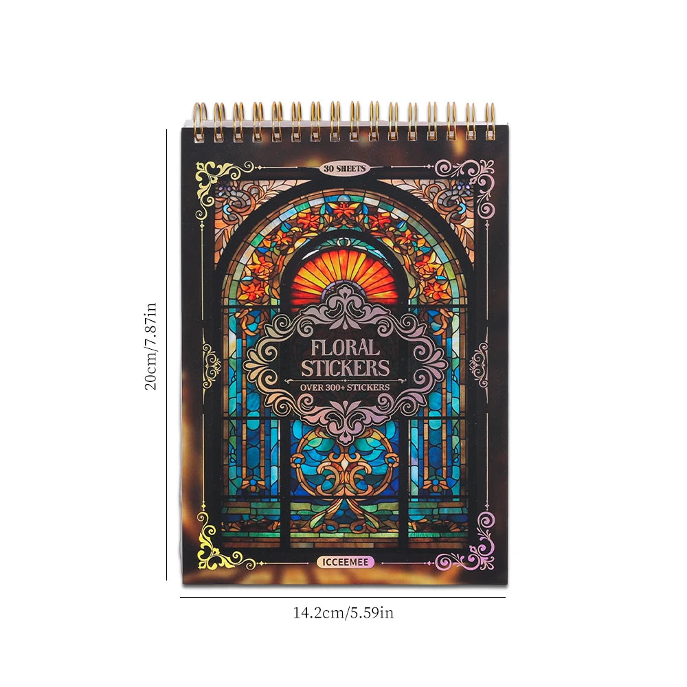 A black spiral-bound notebook filled with vintage floral window design stickers and decorative elements.
