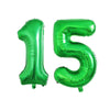 Green foil number balloons spelling out fifteen for a birthday party