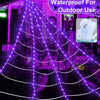 Purple waterproof giant spider web LED lights illuminating an outdoor area.