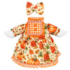 A yellow and orange floral dress for a goose featuring an orange plaid collar and matching bow