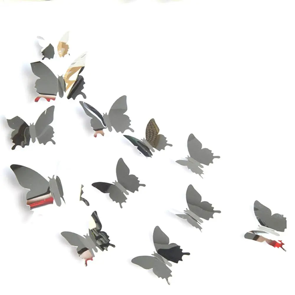 A collection of twelve mirror effect butterfly wall stickers in various shades of gray and black.
