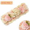A long panel of pink and cream artificial silk rose flowers used for weddings and events.