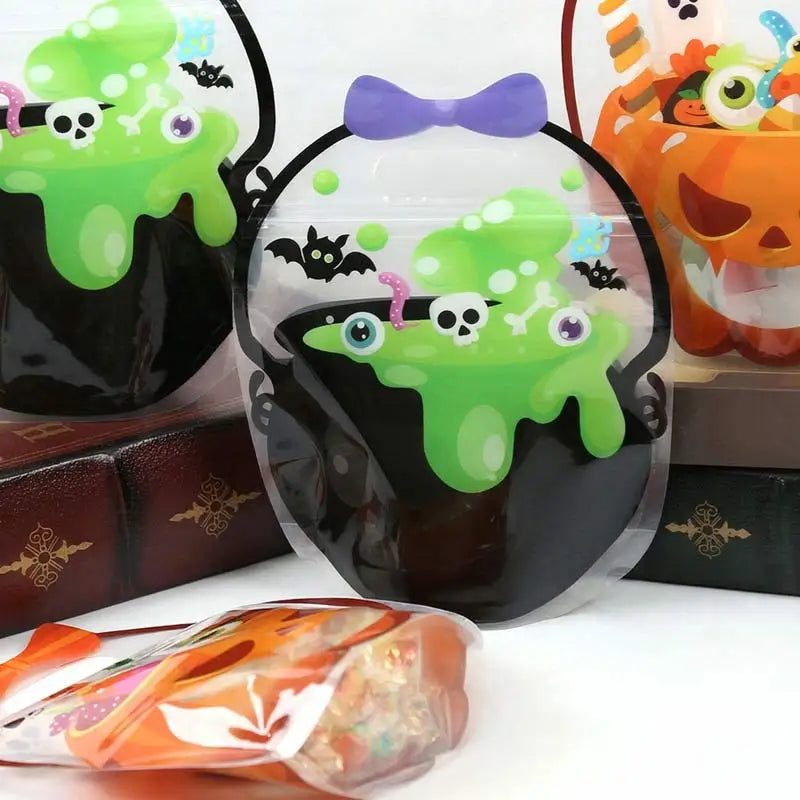 A clear plastic bag filled with green slime and a skull, used as a Halloween witch treat bag.