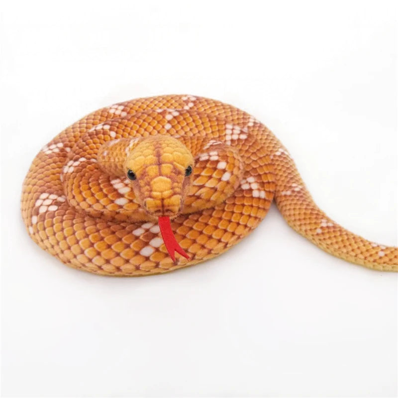 A realistic snake plush toy resembling a boa constrictor with golden-brown and white patterned scales.