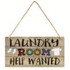 Vintage wooden farmhouse hanging sign with the text Laundry Room Help Wanted carved into the wood.