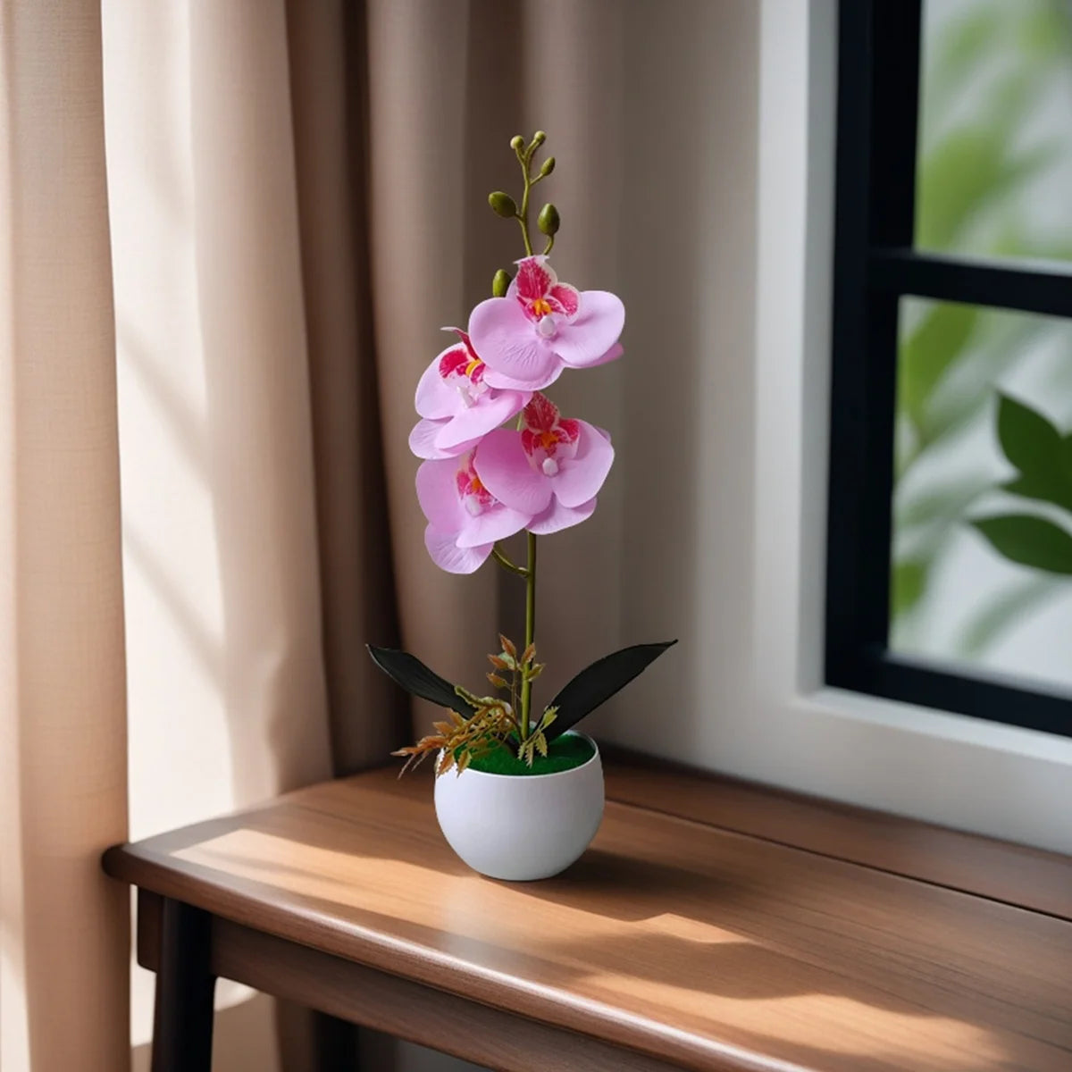 A realistic artificial orchid potted plant with pink flowers sits on a wooden table next to a window.