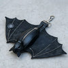 Black leather bat-shaped wallet and keychain with a zipper coin purse