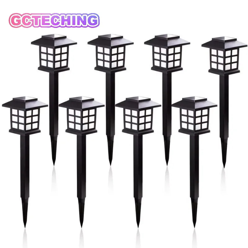 A set of eight black solar powered LED pathway lights with square lanterns.