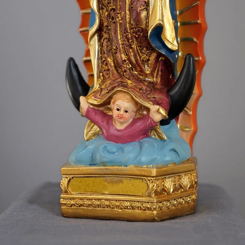 Hand-painted resin statue of Our Lady of Guadalupe with gold and blue accents.