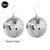 Two silver disco mirror balls with earring hooks for parties and decor