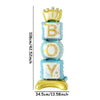 A stack of gold and blue foil balloons shaped like letters B O Y with a crown on top
