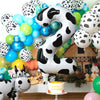 A large black and white cow print number foil balloon shaped like the number 2, used for a farm-themed birthday party decorat
