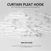 A pile of white curtain pleat hooks made of high-quality stainless steel for use in various curtains.