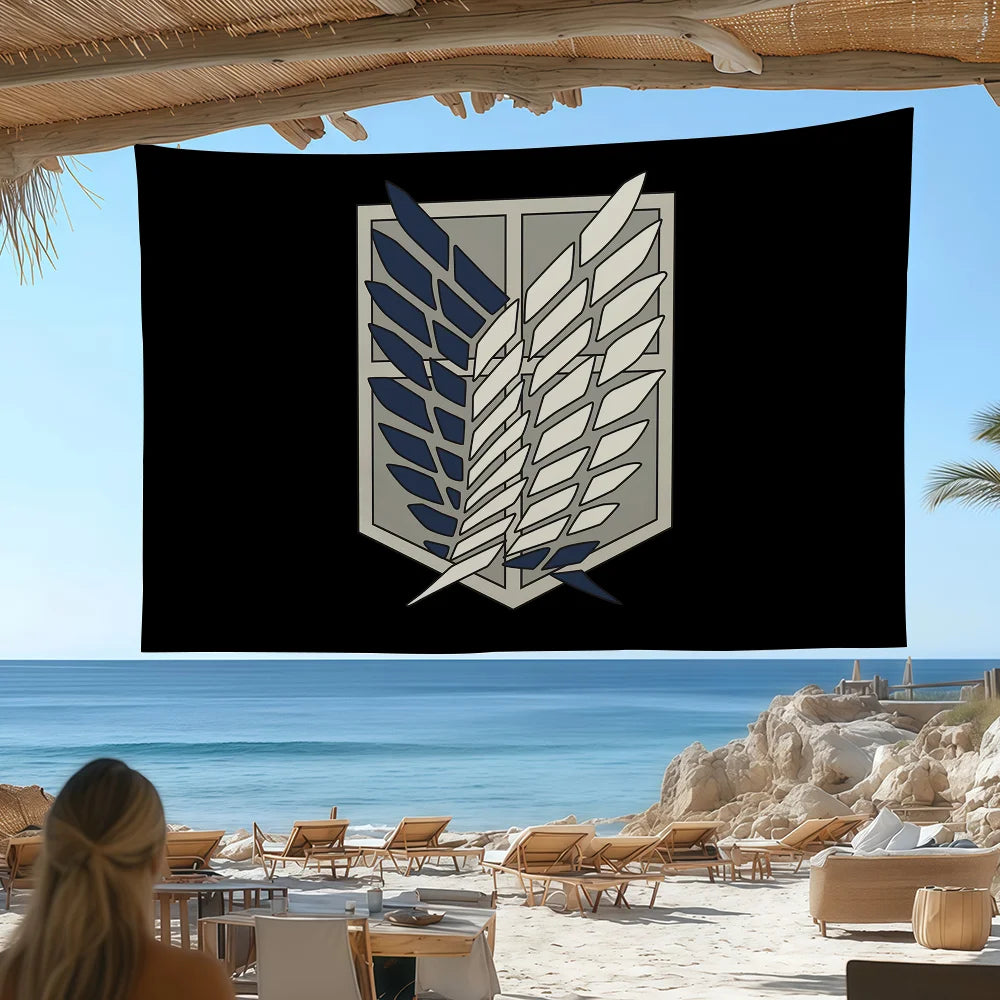 A black banner displaying a silver and blue crest flag design, viewed outdoors near the ocean.