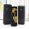 Three black gift boxes with gold foil roses and certificates displayed on a white surface.