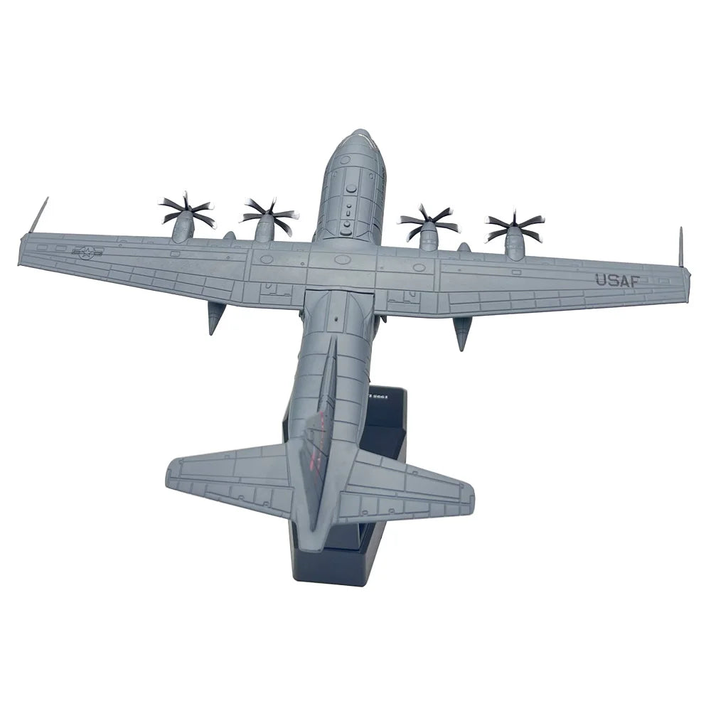 A gray 1:200 scale diecast model of a USAF C-130 Hercules aircraft in a top-down view.