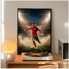 A framed poster of Cristiano Ronaldo in a red shirt playing soccer against a bright stadium background.