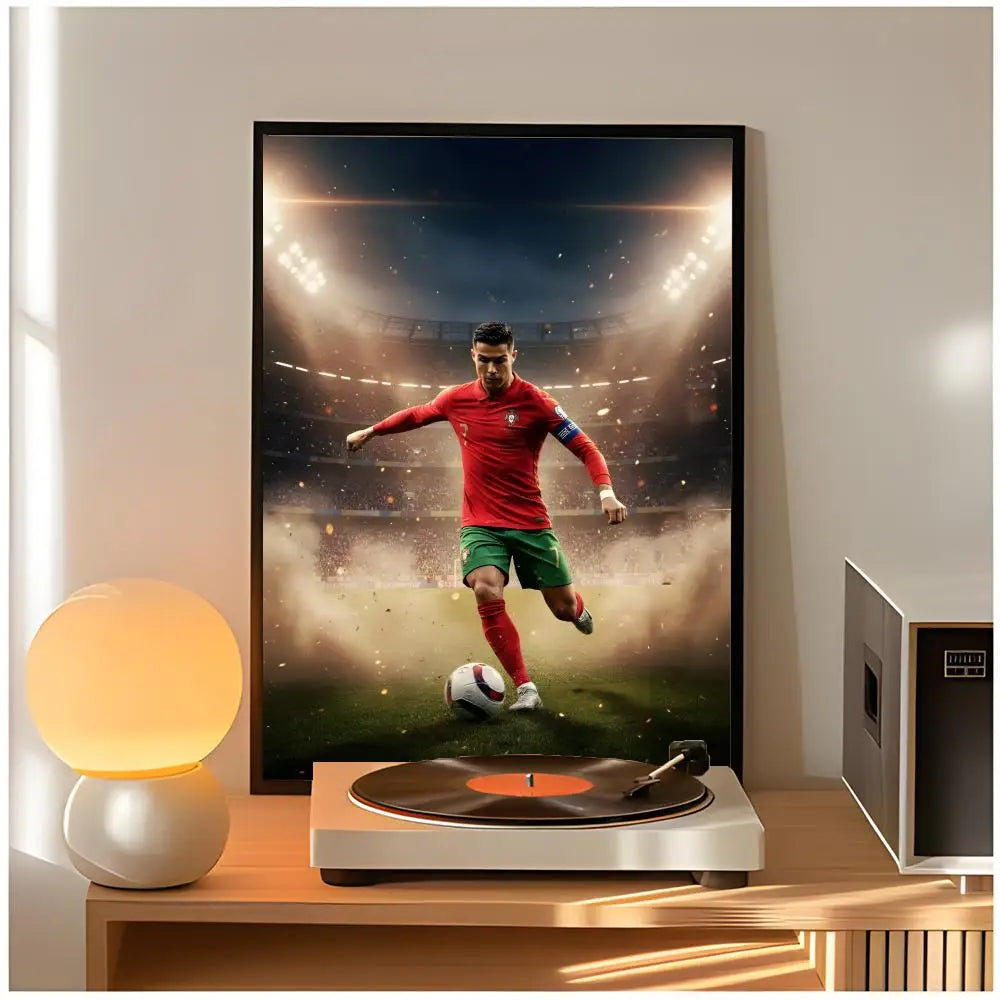 A framed poster of Cristiano Ronaldo in a red shirt playing soccer against a bright stadium background.