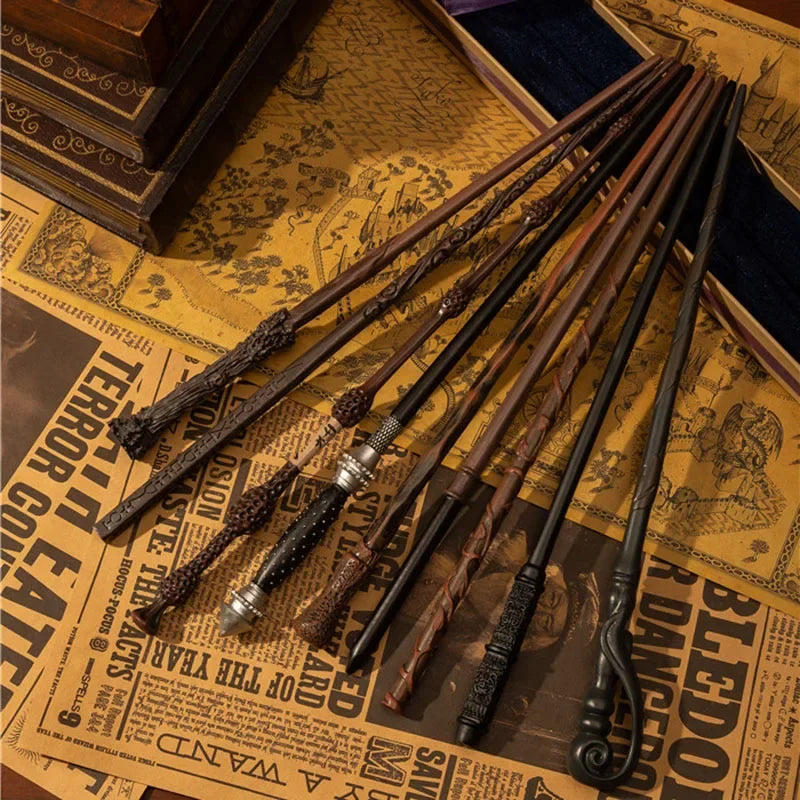 A collection of dark wood and metal magic wands displayed on aged parchment paper.