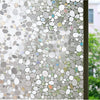 Close-up of frosted window privacy film with iridescent, bubbly texture.