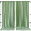 A pair of floor-length, pleated sage green satin backdrop curtains hanging on a stand.