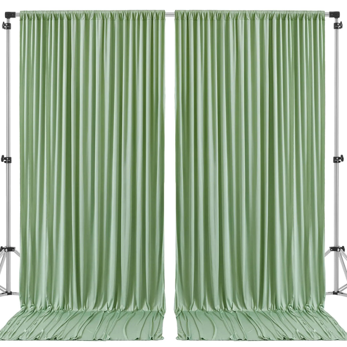 A pair of floor-length, pleated sage green satin backdrop curtains hanging on a stand.