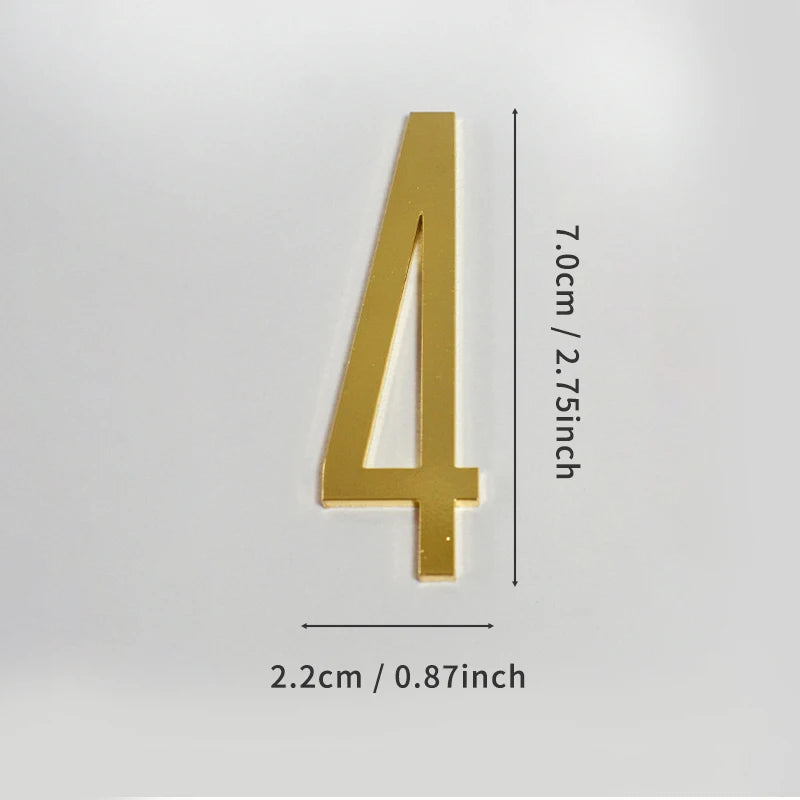 A polished gold house number with a vertical orientation, measuring 7.0cm or 2.75 inches tall.