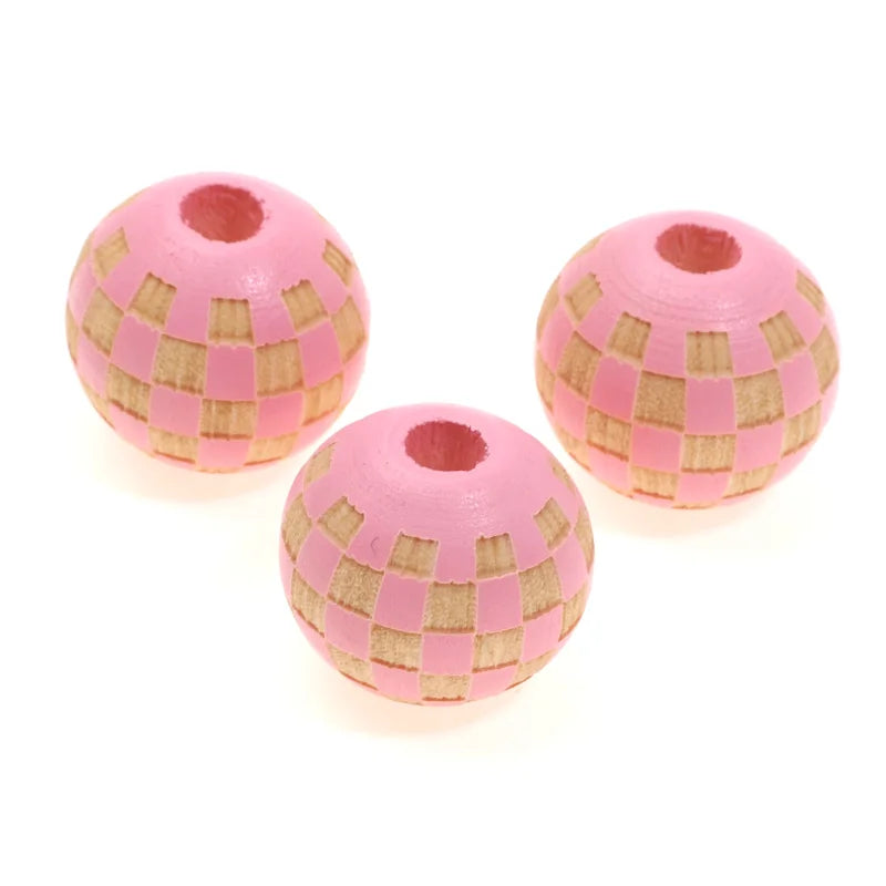 Three natural wooden checkered beads for jewelry making, pink and tan.