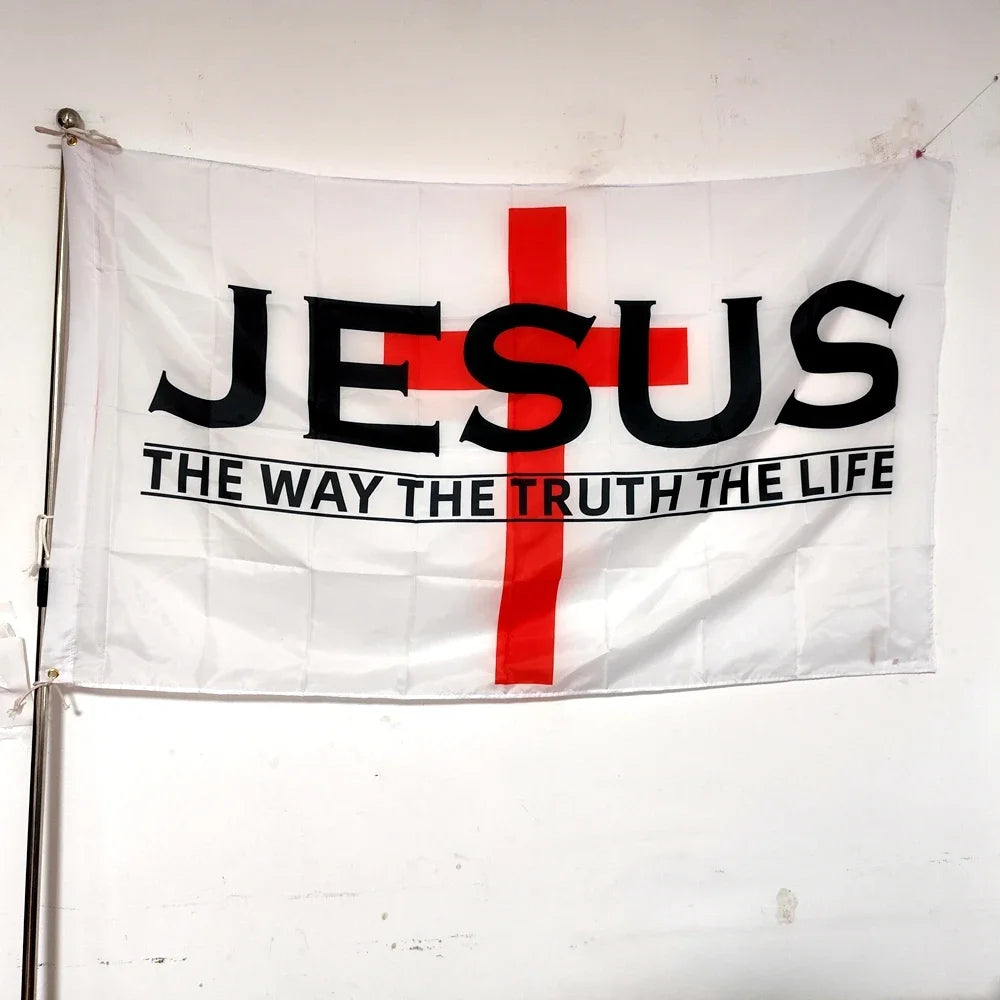 A white banner with the word JESUS and a red cross, featuring the text THE WAY THE TRUTH THE LIFE.