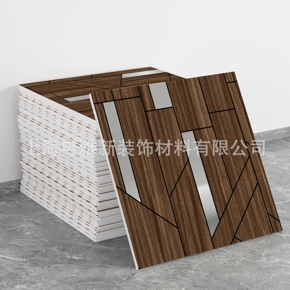 A display of brown wood-look marble peel-and-stick tiles with silver accents, shown in a stacked and laid out configuration.