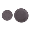A pair of dark gray gas stove burner caps for efficient cooking.