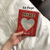 مجلد أحمر بزجاجة على شكل قلب وعبارة 'MINE and I LIKE IT' على ورقة بيضاء