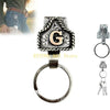 A silver and black Western metal belt keychain featuring a large engraved letter G and a quick-release clip.