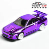 A diecast model of a Nissan GTR R34 sports car with an electroplated purple finish and a raised hood.