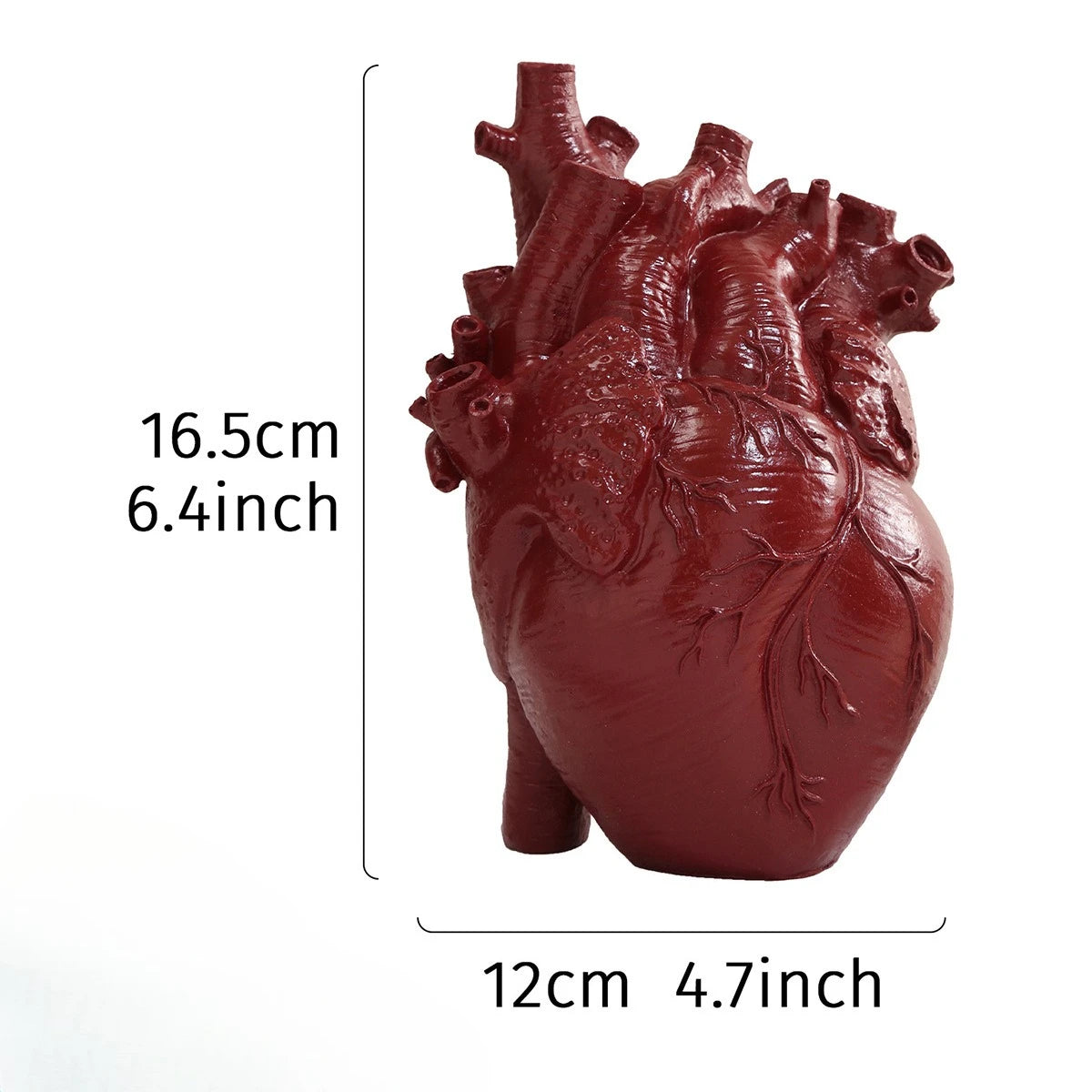 A reddish-brown heart-shaped resin sculpture used as a tabletop vase.