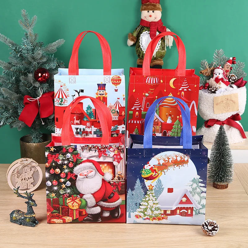 Red and blue non-woven gift tote bags with festive Christmas prints displayed on a wooden surface.