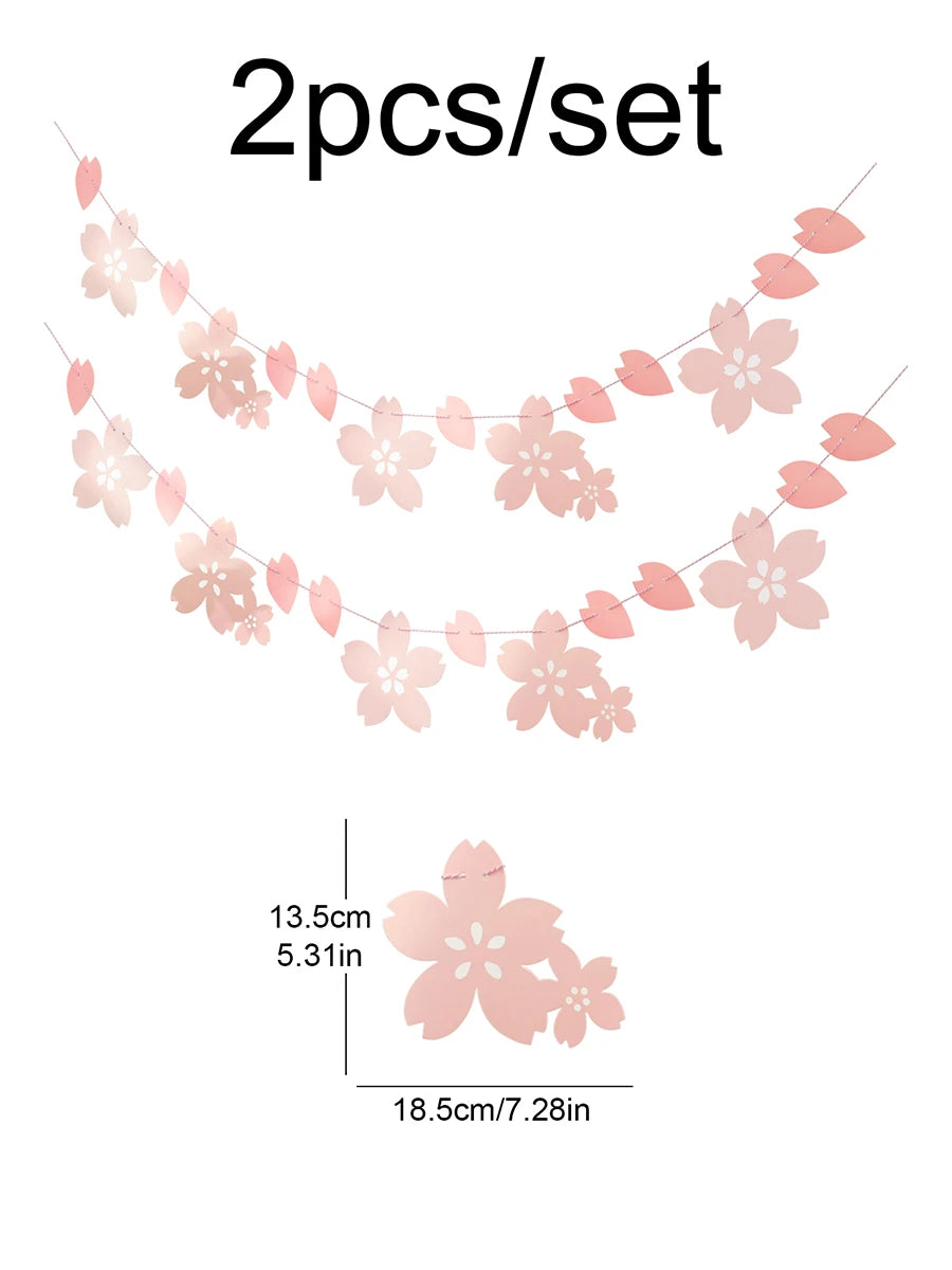 A delicate pink cherry blossom paper flag banner featuring two strands of flowers.