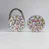 A silver handbag hook with a floral pattern is shown against a white background.