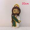Handcrafted Virgin Mary crochet doll with dark hair and a green and white garment.