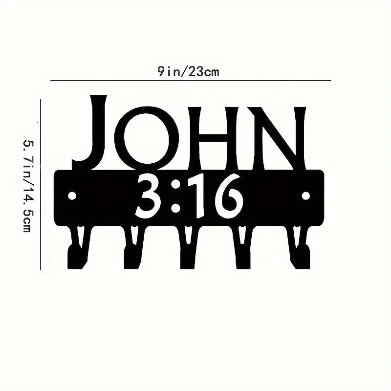 Black metal wall-mounted key holder with seven hooks displaying the name John and time 3:16
