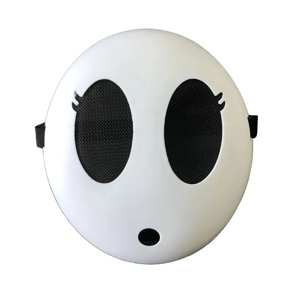 A white, round mask resembling a shy guy face with large black eye holes.