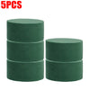 Five round blocks of green floral foam for flower arrangements